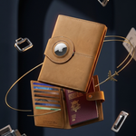 A tan leather passport holder and document organizer with a circular flap closure, shown floating with passports, cards, and small travel accessories around it against a dark blue studio background.