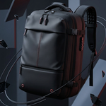 A dark gray and black backpack with subtle red stitching details, shown floating in a stylized dark studio environment with floating geometric props.