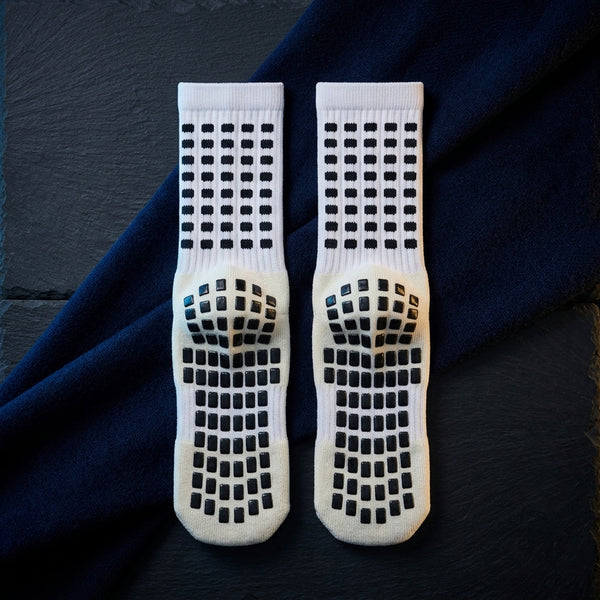 Non-slip travel socks showing the grip pattern on the soles