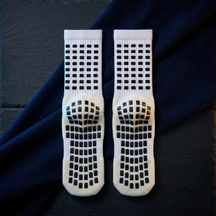 Non-slip travel socks showing the grip pattern on the soles