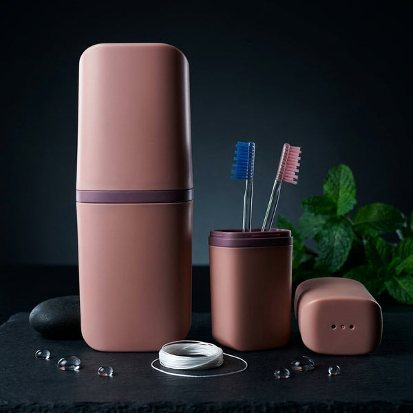 The toothbrush holder set in dusty rose with toothbrushes