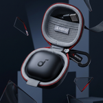 A black and gray protective earbud case with red trim, shown open with a wireless earbud inside. The case is floating against a dark blue geometric background with glass shards around it.