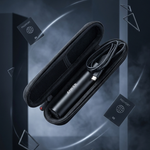A sleek black cylindrical electronic device with a coiled cable inside an open hard carrying case, shown floating against a dark smoky studio background with floating packaging pieces.